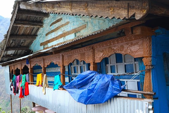 Conquering kedarkantha trek: A Winter Wonderland in Uttarakhand 3 craved wooden house min